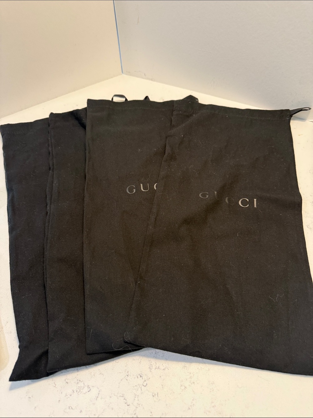 Four Gucci Black Logo Dust Bags
